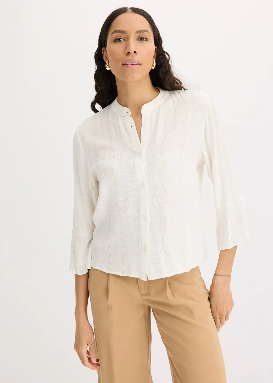 Bluse mit Volant und Perlen